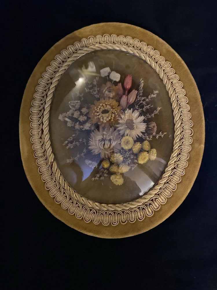 Vintage oval glass dome framed dried flower arrangement with purple, yellow and pink blooms