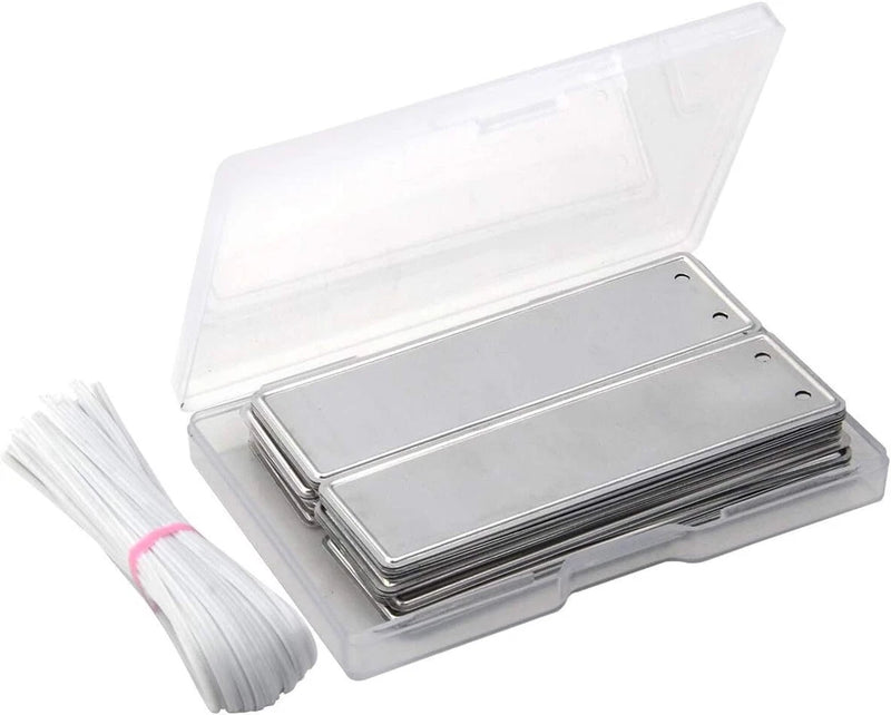 Silver metal plant label tags with wires, stacked in a storage box