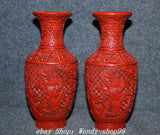 Pair of red lacquer zun vases with embossed peony floral relief