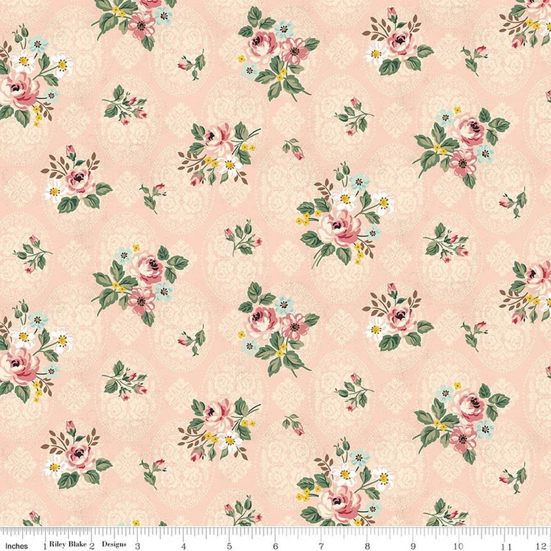 Blush floral cotton fabric with rose, violet, and small yellow flower clusters pattern