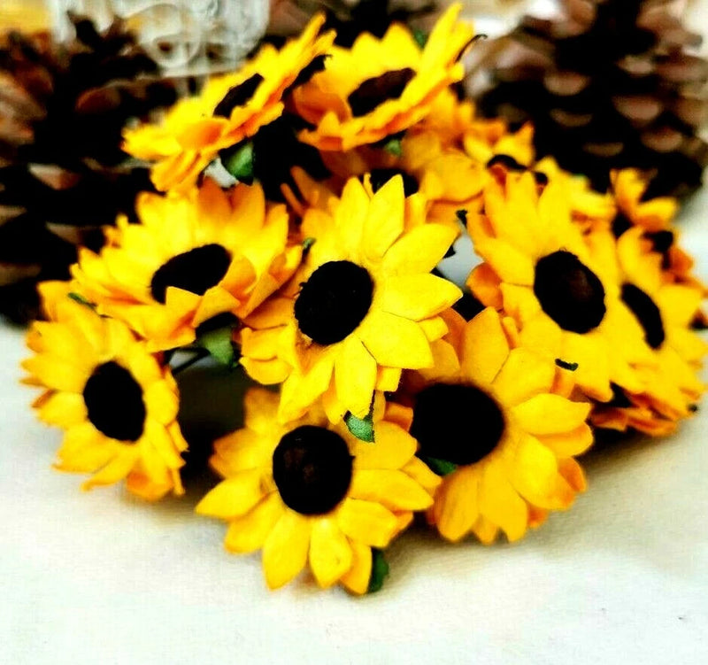 Yellow sunflower paper flowers with dark centers for craft and wedding decoration