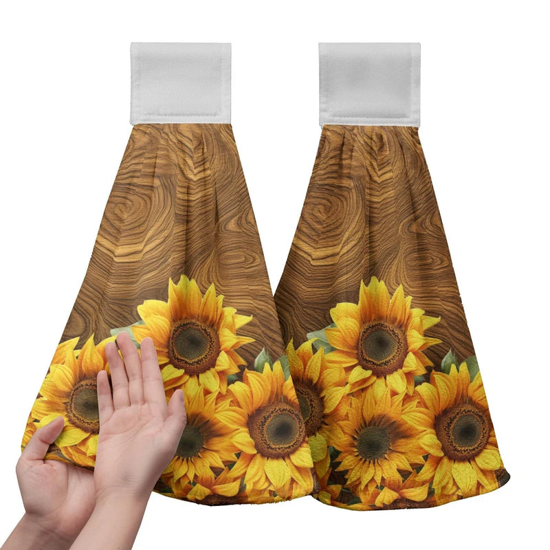 Hanging kitchen towels with brown fabric and bright yellow sunflower print, two panels
