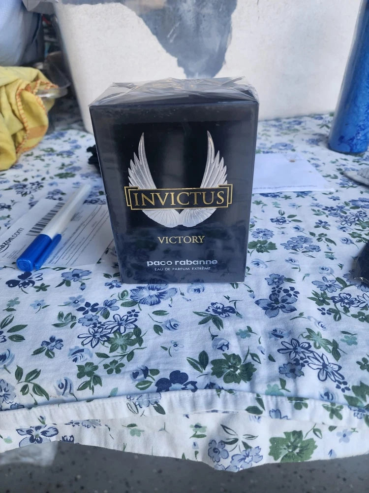 Men's black EDP perfume box with gold Invictus Victory logo, Paco Rabanne