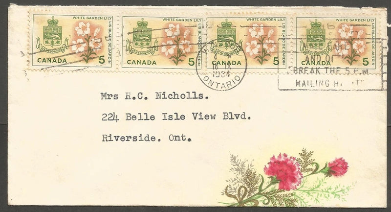 Vintage flower envelope cover with lily illustration and multiple Canada postage stamps
