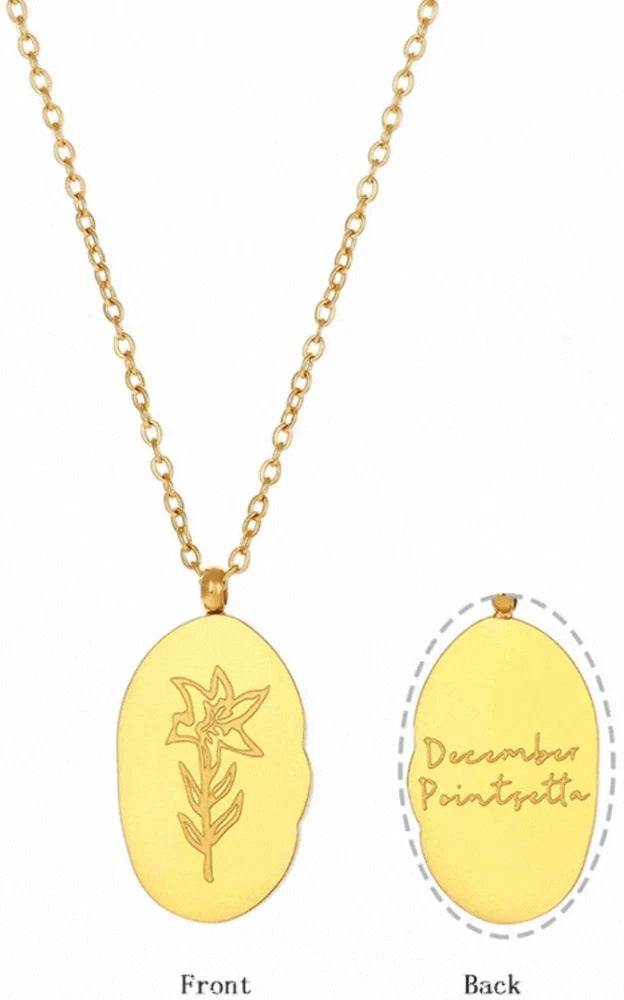 Gold-tone oval pendant necklace with engraved flower motif, cable chain