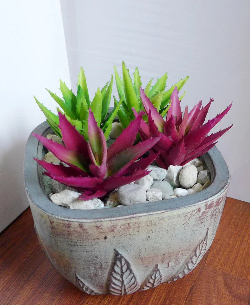 Artificial succulent plants in round gray planter, green and magenta rosette leaves