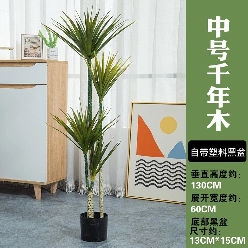 Artificial potted tree plant with three stems and narrow green leaves in a black pot