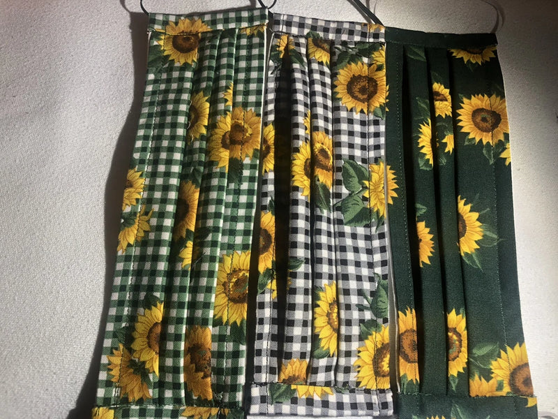 Set of 3 cotton face masks with sunflower prints, green gingham, and elastic ear loops