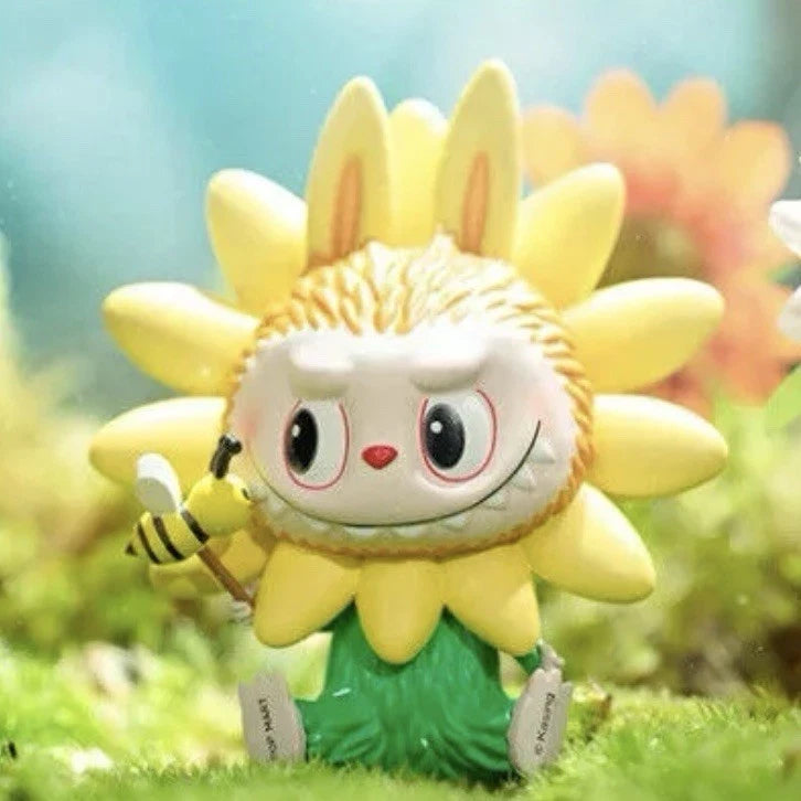 Sunflower plush elf figurine with yellow petals, green dress, holding a small bee wand