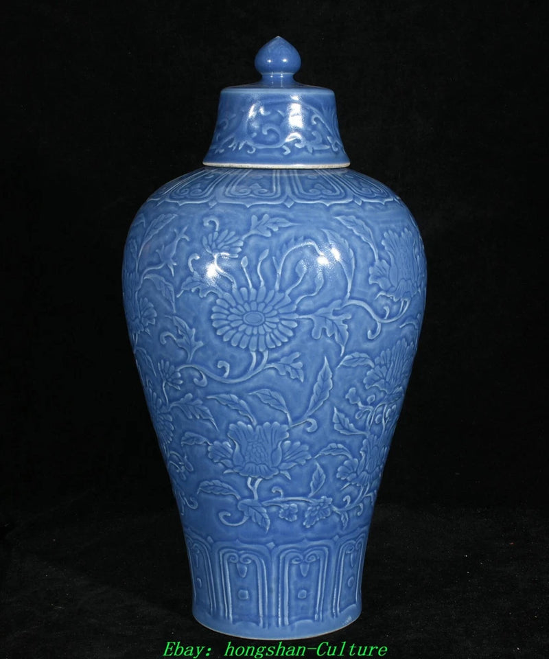 Blue porcelain lidded jar with raised peony and floral pattern, 13.7 in