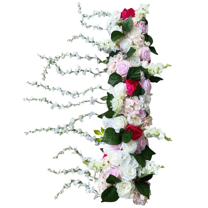 Artificial flower wall arrangement with pink, white and red peony roses, green leaves, bead garland