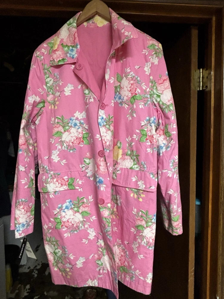 Reversible pink floral jacket with button front and notched collar