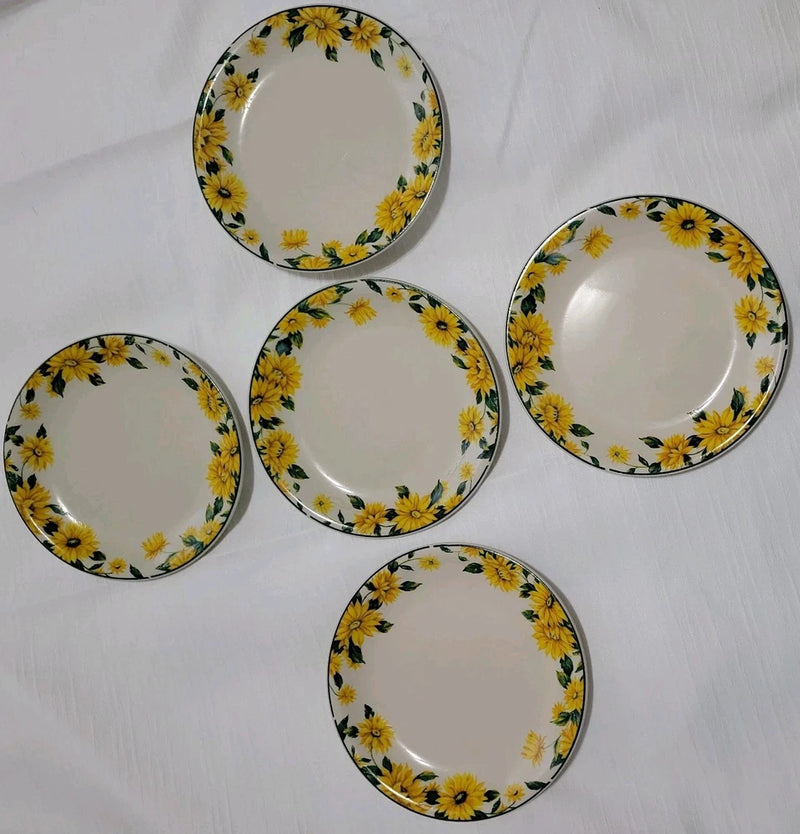 Set of 5 salad plates with white base, gold rim, and sunflower floral border