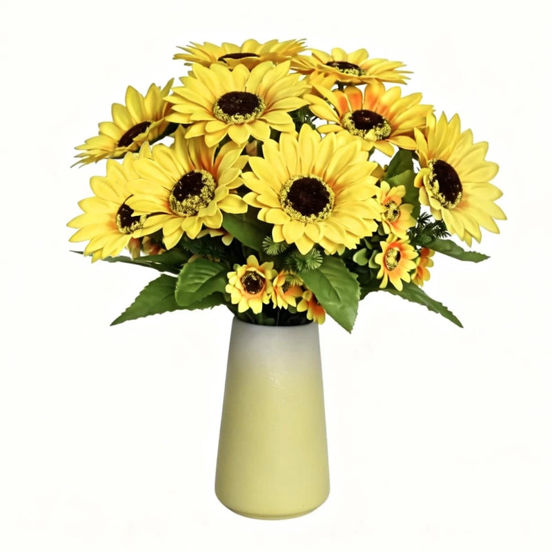 Artificial sunflower table centerpiece with yellow ceramic vase and green leaves