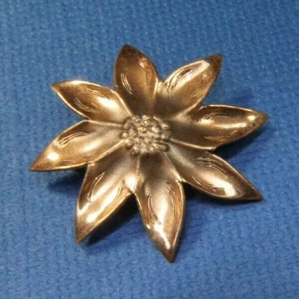 Copper sunflower 8-petal brooch pin with textured center, gold-tone metal flower.