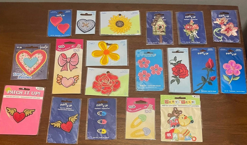 Sunflower iron-on applique on a blue backing card, in a set of patch packets