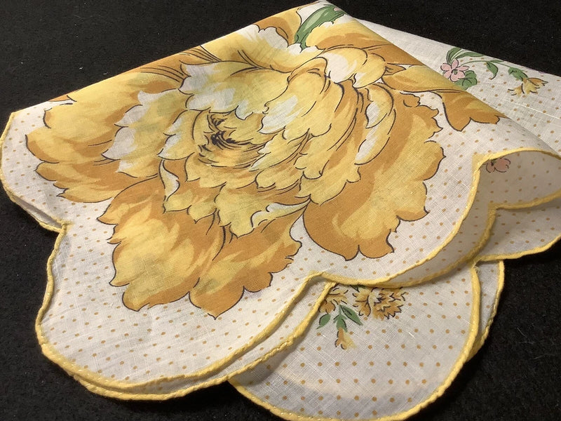Vintage floral handkerchief with yellow carnation print, white dotted border, scalloped edge