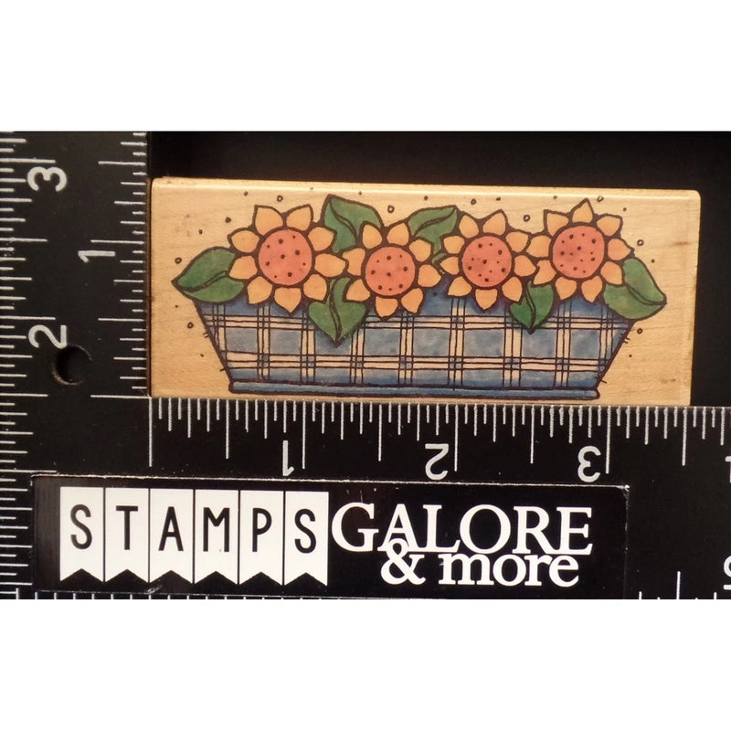 Sunflower planter rubber stamp on wood block with flower heads and green leaves