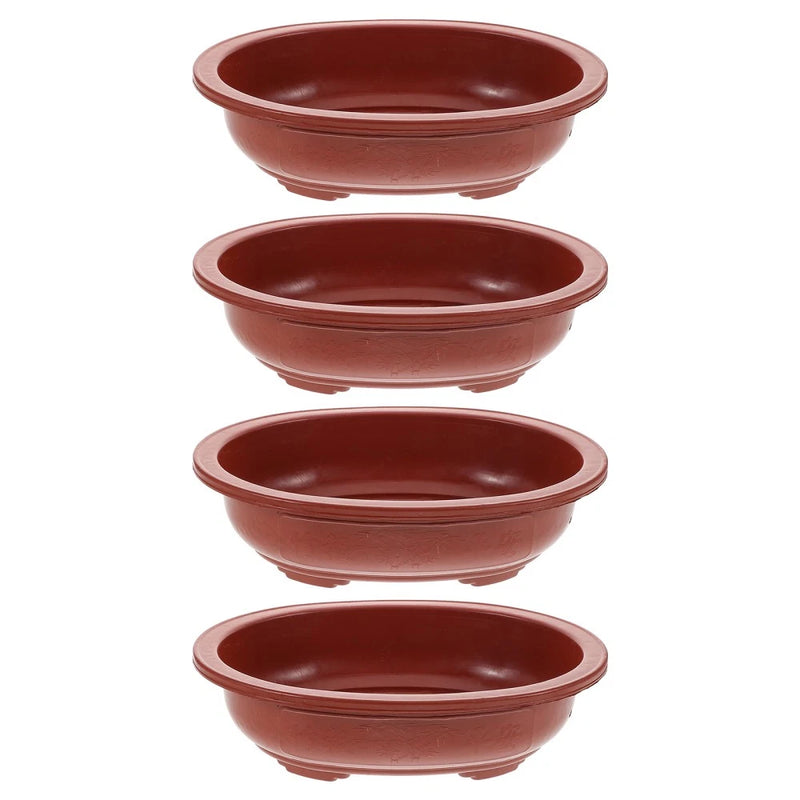 Small round terracotta-style plant containers, bonsai pots with curved rims