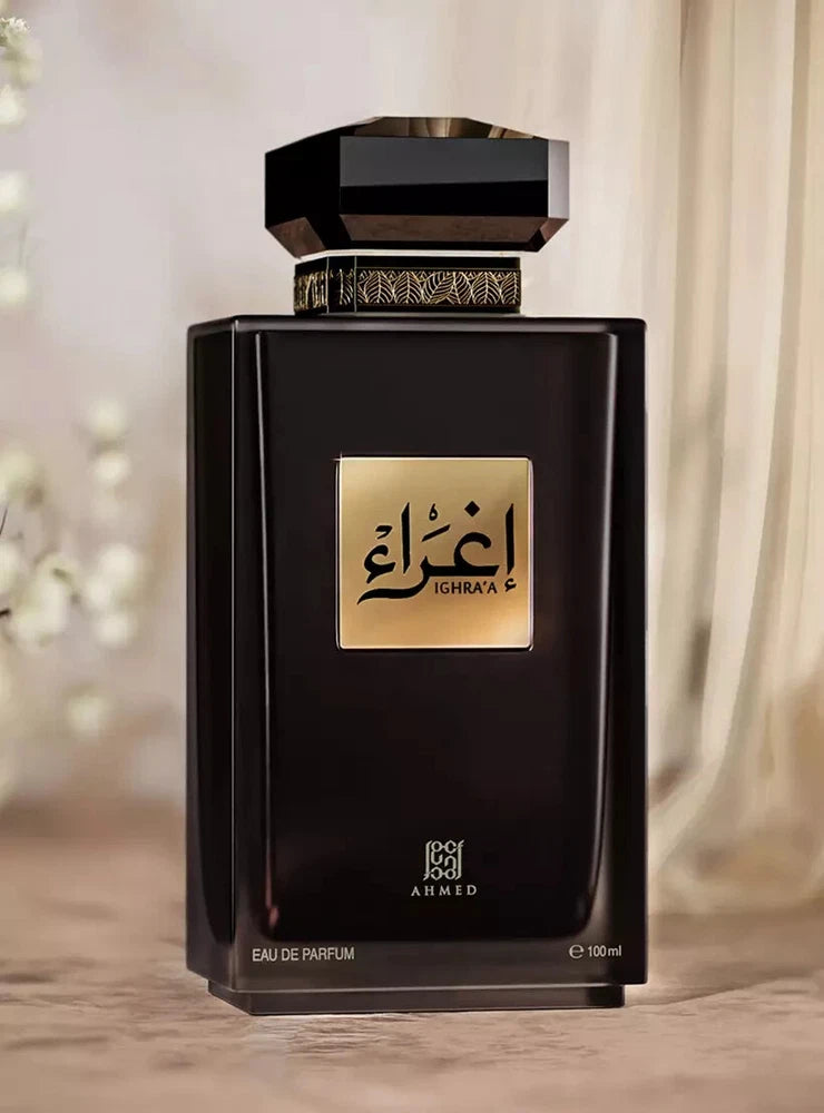 Unisex eau de parfum bottle, dark glass with gold cap and Ighraa label, 100 ml