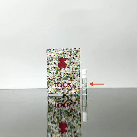 Perfume sample vial set with colorful confetti label and small spray bottle