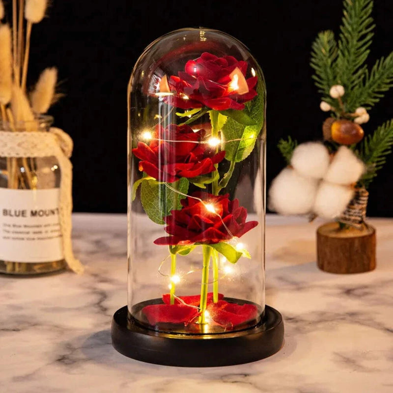 LED artificial rose flowers under glass dome with warm string lights