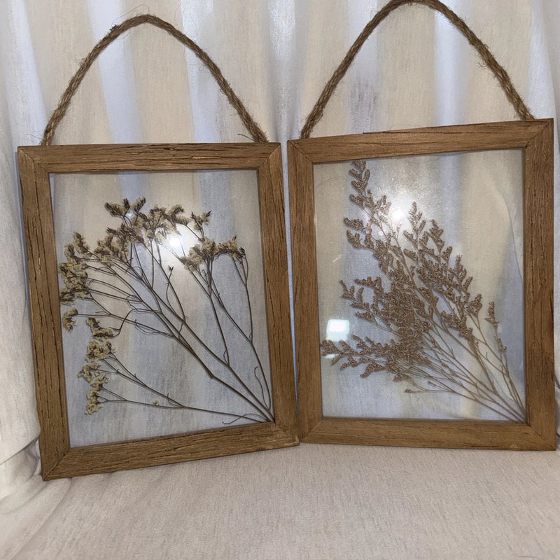 Wood framed dried flower art with pressed botanical stems in warm tan tones