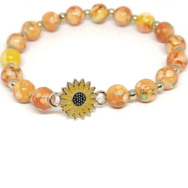 Sunflower beaded stretch charm bracelet with peach round glass beads and silver sunflower charm
