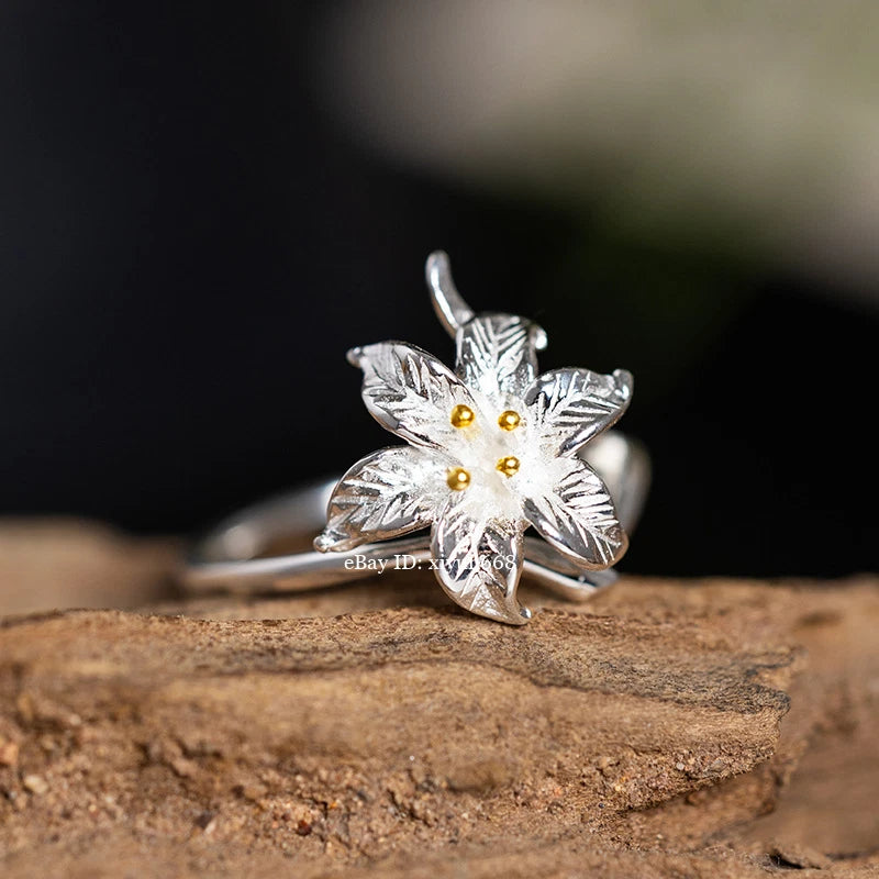 Silver lily flower ring with gold center, thin band for women