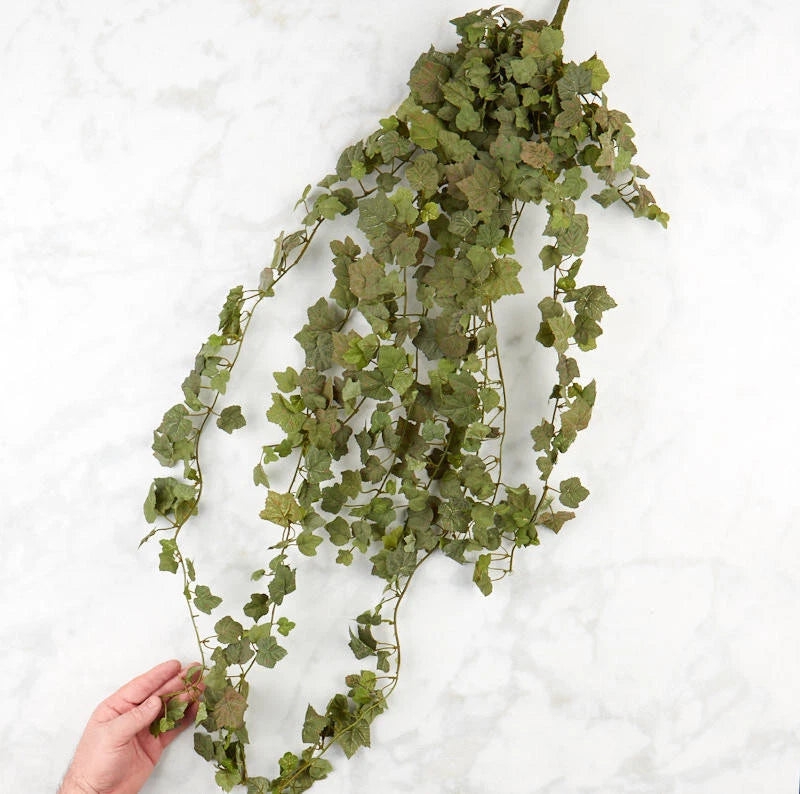 Cascading artificial ivy floral bush with green hanging vines and leaves