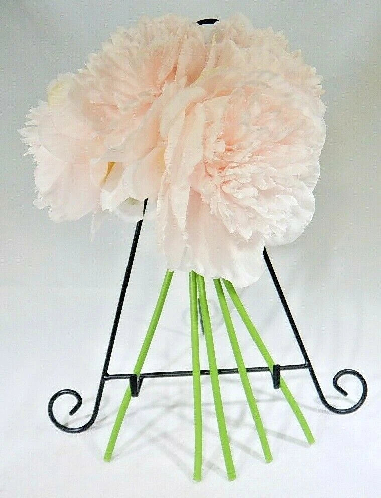 Artificial peony-style silk flower bouquet with four pale peach flower heads and green stems on stand