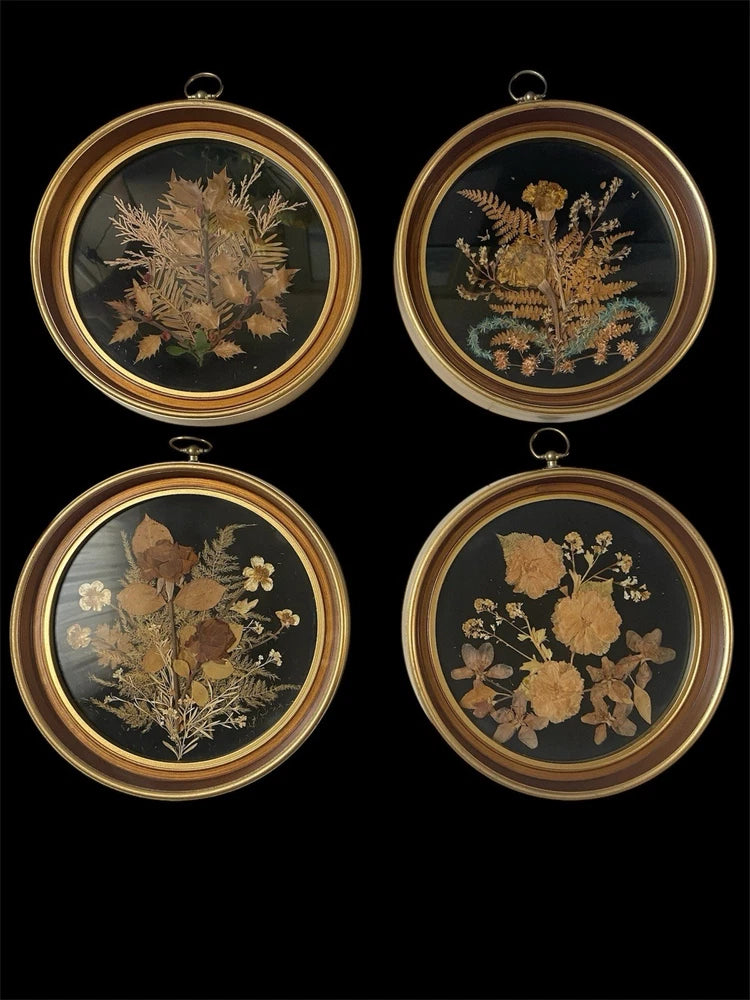 Set of 4 gold-framed pressed flower wall art medallions with dried botanicals