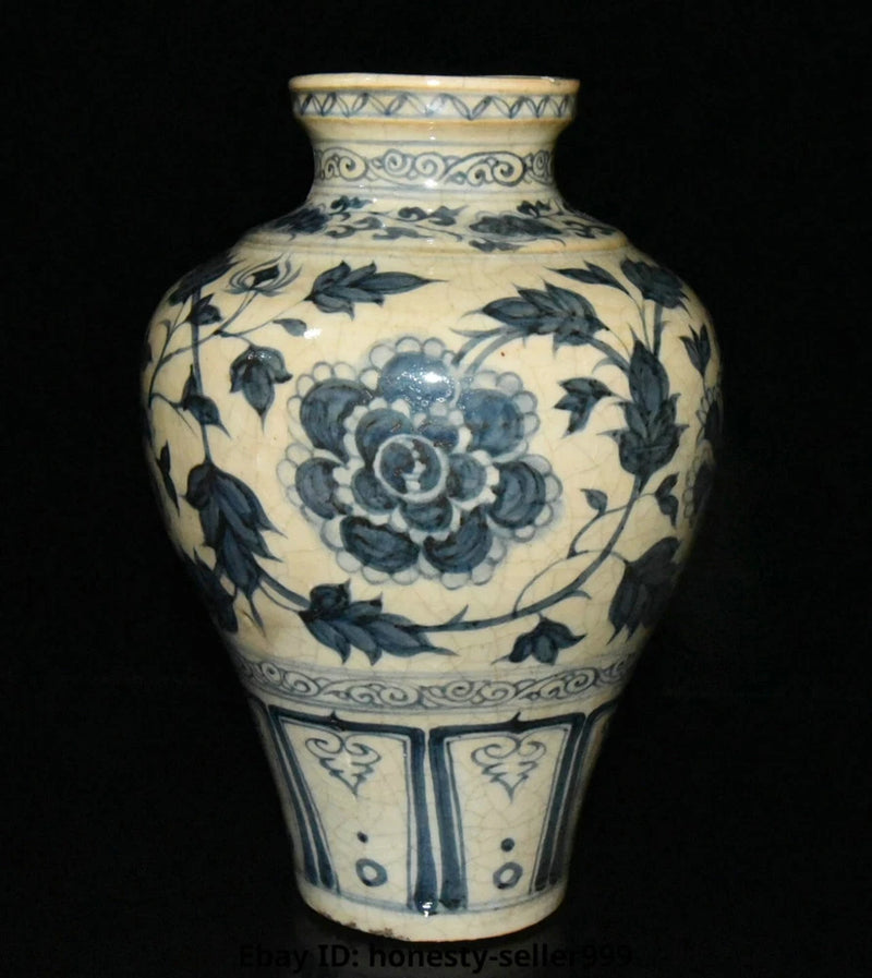 Porcelain bottle vase in white with blue peony and floral scrolls, short neck.