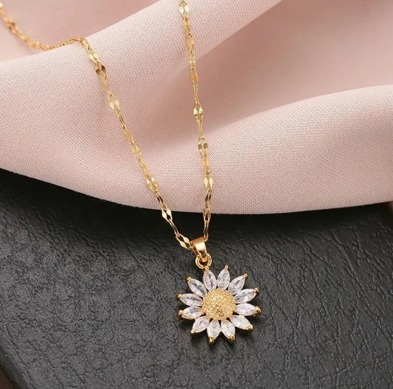 Gold-tone necklace with sunflower rhinestone pendant on a fine chain