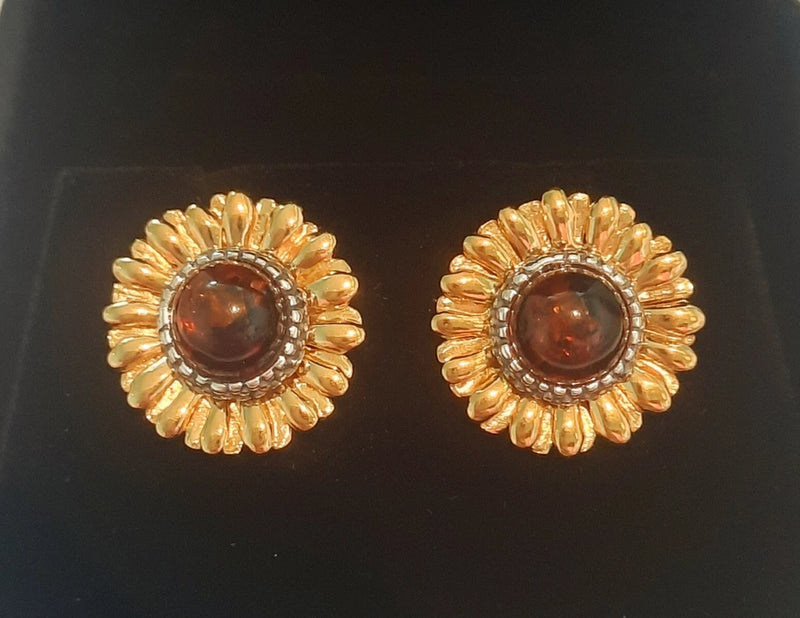 Sunflower stud earrings with gold-tone petals and amber-brown round centers