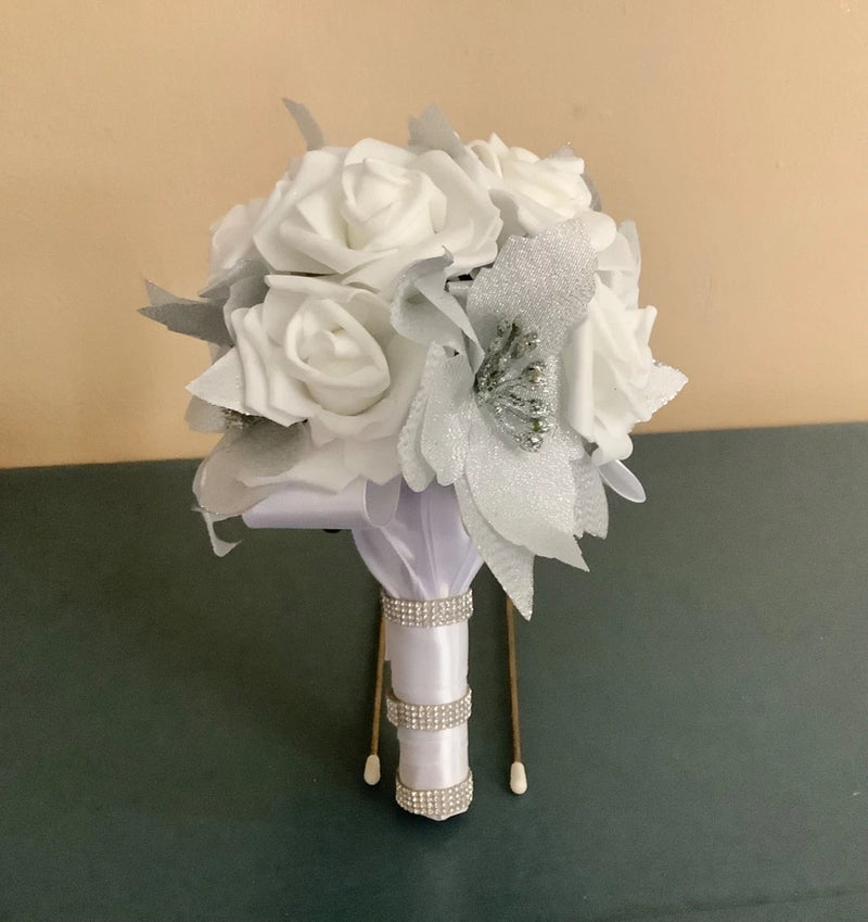 White rose and silver glitter bouquet with beaded handle and dangling pearl-like accents