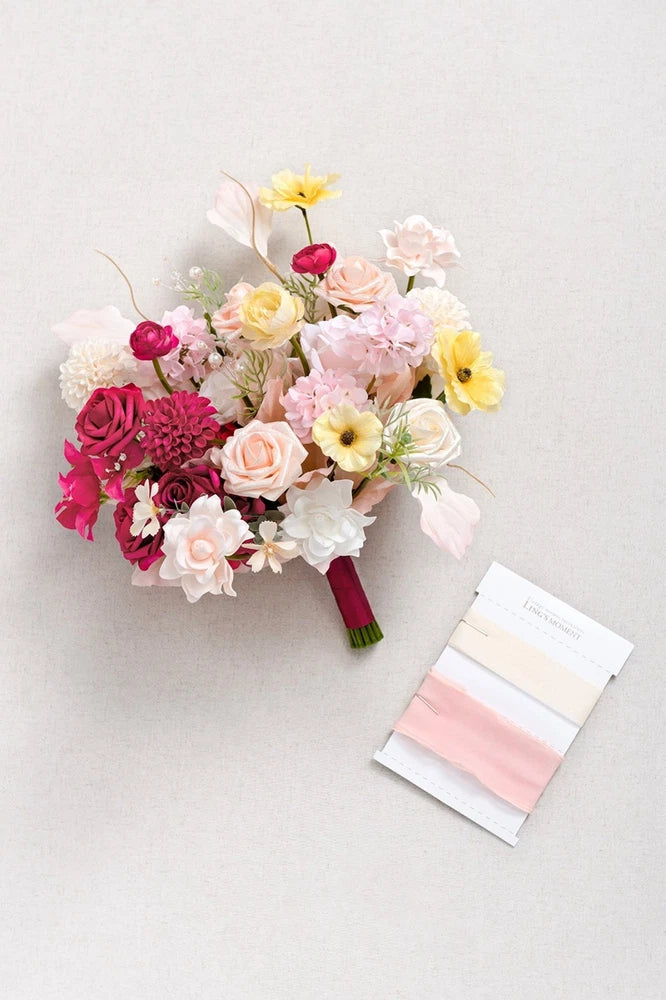 Small free-form bridal bouquet with pink, blush and white mixed flowers and satin-wrapped handle