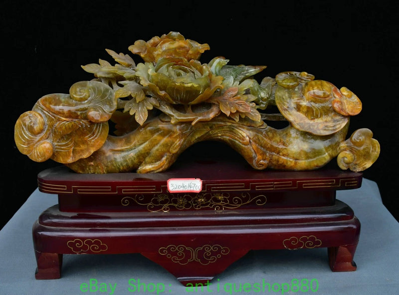 Natural xiu jade carved peony ruyi statue with curled details on wooden base