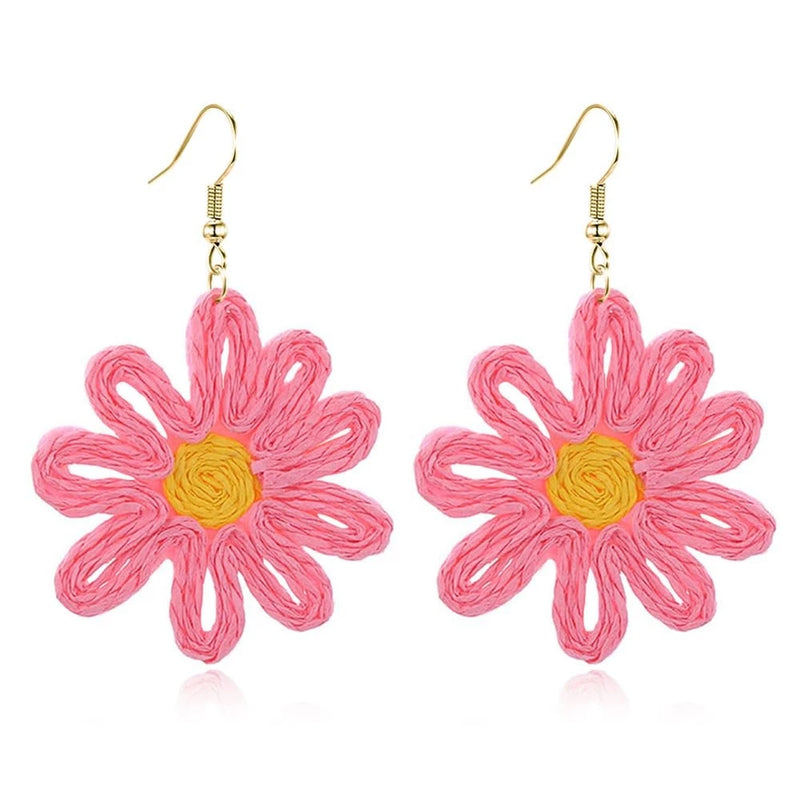 Pink raffia flower drop earrings with yellow center and gold-tone hooks