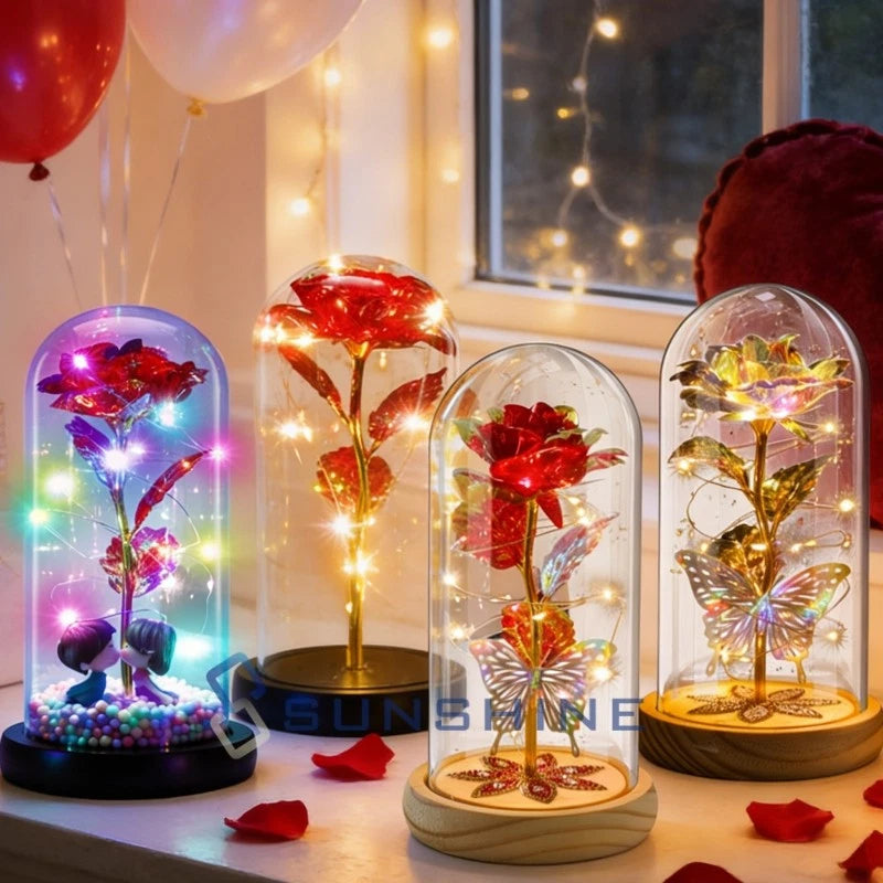 LED light rose under clear dome with glowing butterflies and red flower, on wooden base