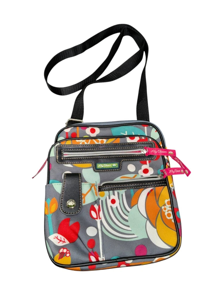 Small crossbody bag with multicolor abstract floral print, front zip pockets, adjustable strap