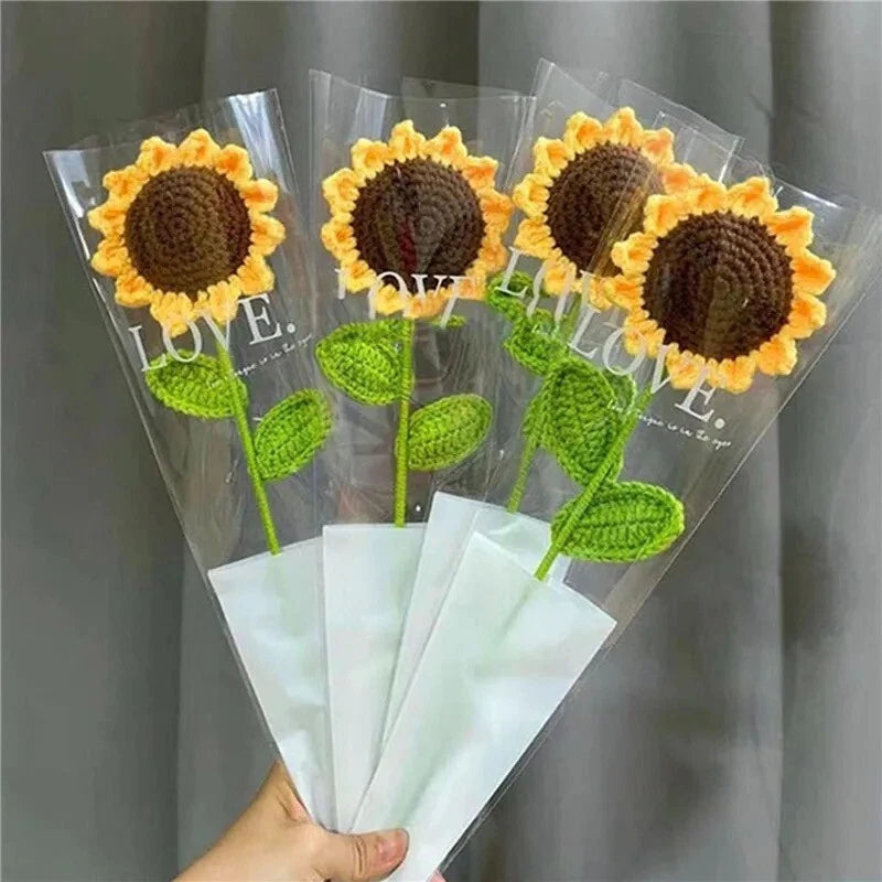 Woven sunflower flower picks with green leaves, in clear sleeves marked LOVE