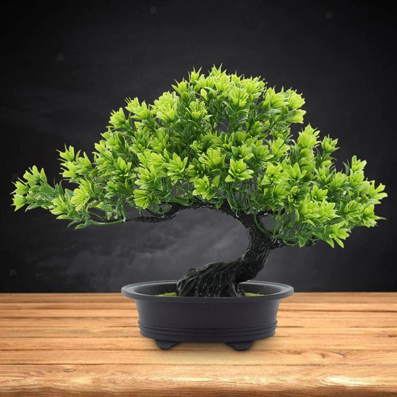 Artificial bonsai tree with bright green dense foliage in a dark round pot