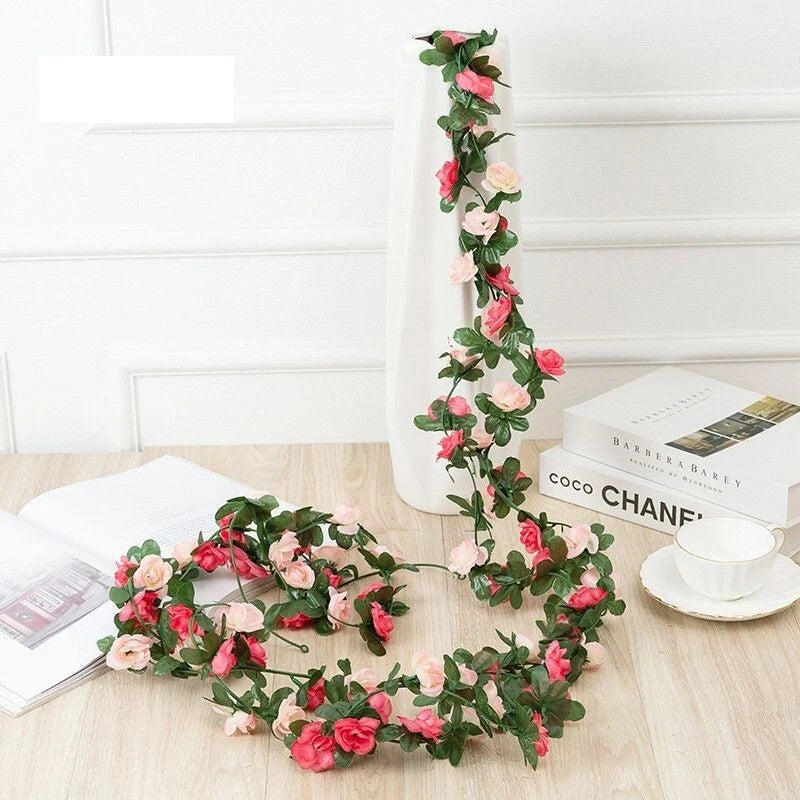 Artificial peony flower garland with pink and red blossoms and green leaves