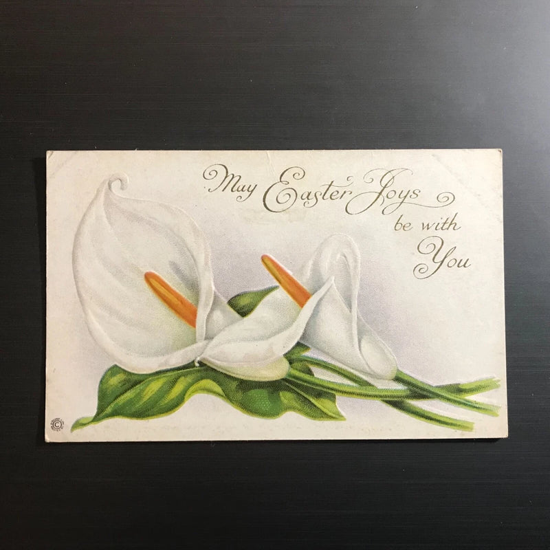 Embossed Easter postcard with white calla lilies and green leaves