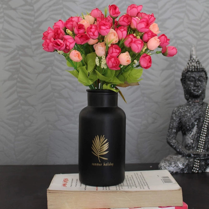 Set of 4 pink mini faux peony flowers with green leaves in a black vase
