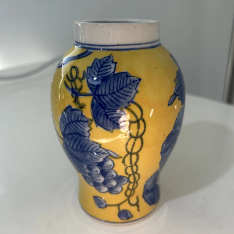 Vintage hand-painted Chinese vase with yellow body and cobalt blue floral pattern