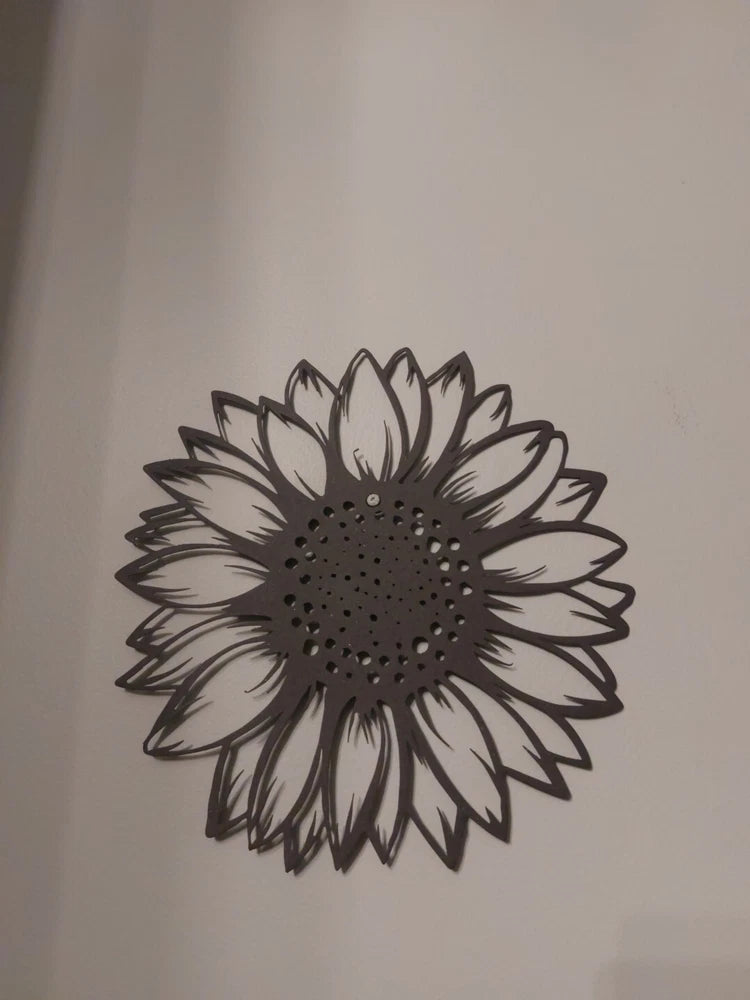 Metal sunflower wall hanging art with spiked petals and dotted center