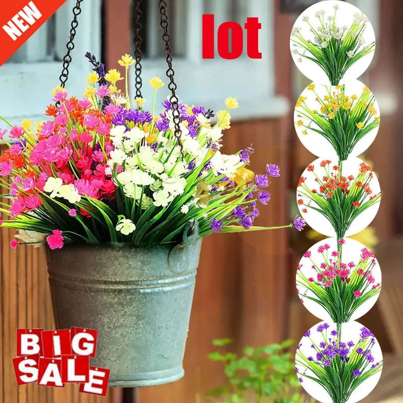 Artificial plastic flower bundle with mixed colorful blooms in a green metal pot