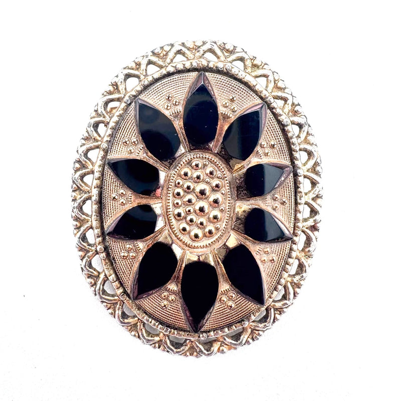 Ornate gold-tone sunflower brooch pin with black glass petals